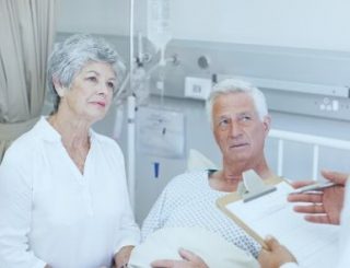 Couple listening to a mesothelioma doctor