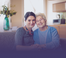 Older mother and daughter embracing each other